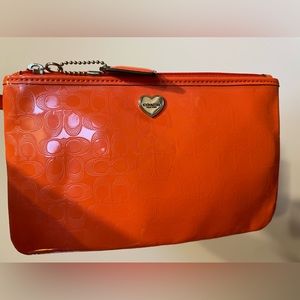 Coach Orange Liquid Gloss Perforated Women’s Patent Leather Wristlet